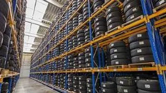 High-bay racking filled with automotive tyres and spare parts