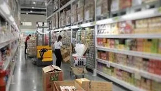 FMCG goods stocked along a distribution warehouse aisle